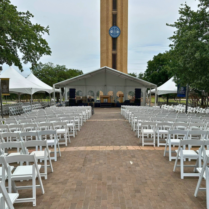 Outdoor graduation ceremony tent rental setup by TLC Event Rentals